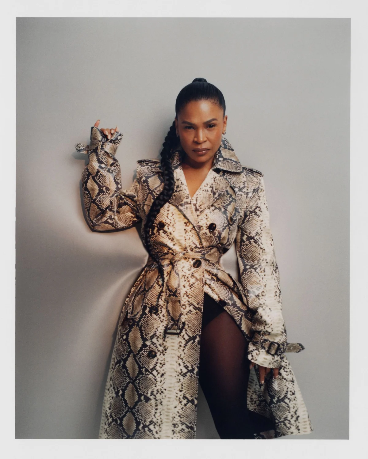 Image may contain Clothing Coat Face Head Person Photography Portrait Dress Adult Long Sleeve Sleeve and Overcoat